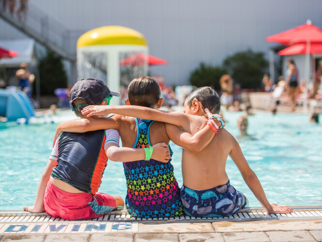 Three Children Sitting Poolside at Peek'n Peak Resort