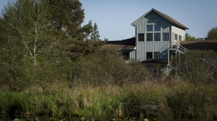 A small white house along the trail.