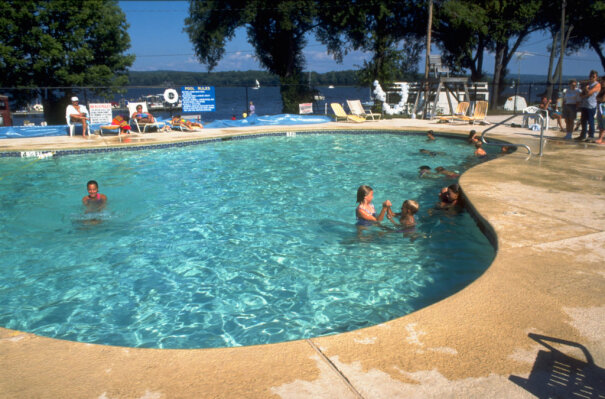 Children swimming in Camp Chautauqua pool.