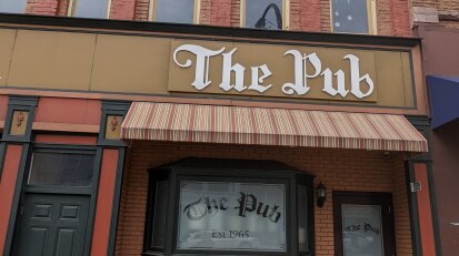 The Pub exterior sign and door