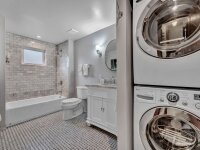 Blue Oar bathroom with washer and dryer