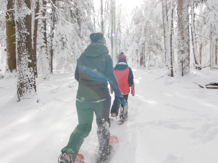 Mom and daughter snowshoeing