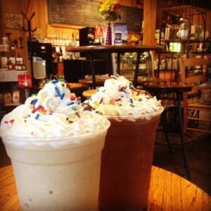 Two milkshakes on a table at Webb's Cottage Collection Café.