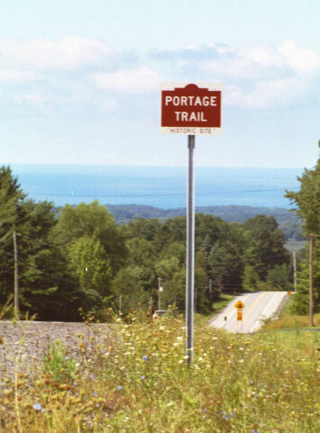 Red signage for Portage Trail.