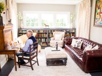 STAY Chautauqua Heights Manor man in library