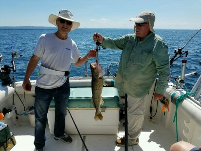 Two men caught a fish on a Lake Erie fishing charter boat