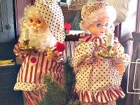 Two dolls dressed in candy stripes.