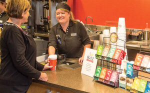 Serving customers at the Buzz Coffee at the local Wegmans.