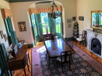 The Plum Bush House fireplace and table