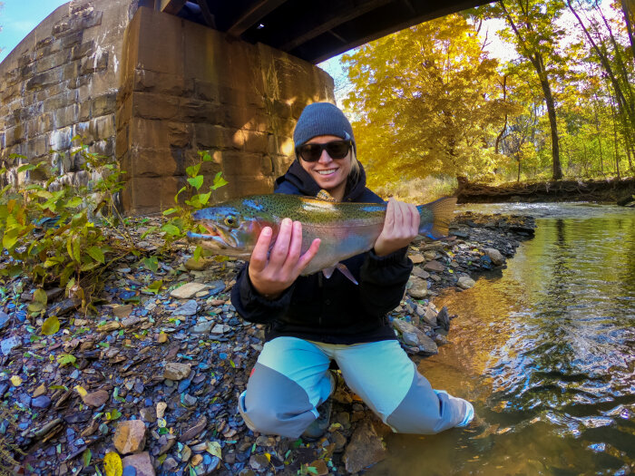 woman catches a Steelhead on Chautauqua Creek