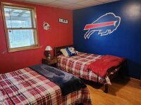 Lakeside Meadows Buffalo Bills themed bedroom with double and single bed