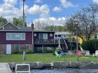 Lakefront Cottages Adirondack Chairs and Fire Pit