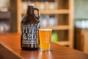 Growler and pint of Five & 20 Beer