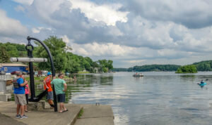 People looking out on Findley Lake form the dock.