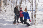 Mother and two daughters snowshoeing at Long Point State Park on Chautauqua Lake