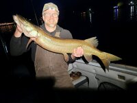 Night Fishing on Chautauqua Lake man with musky