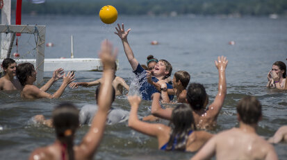 Kids at a summer camp playing handball in Chautauqua Lake