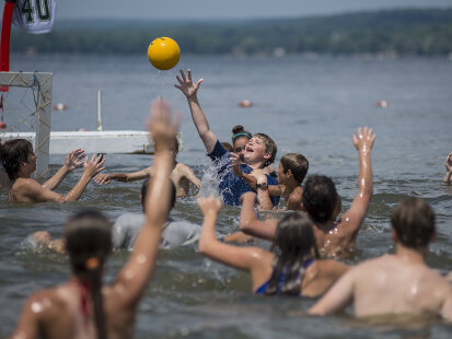 Kids at a summer camp playing handball in Chautauqua Lake