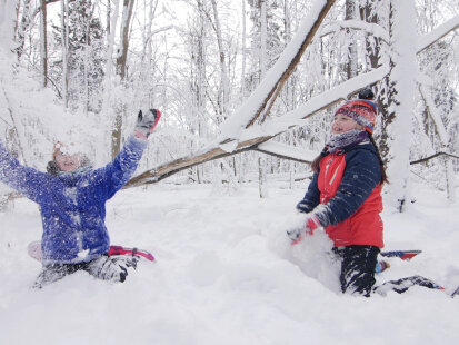 girls-playing-in-snow-long-point-at-chq-lake