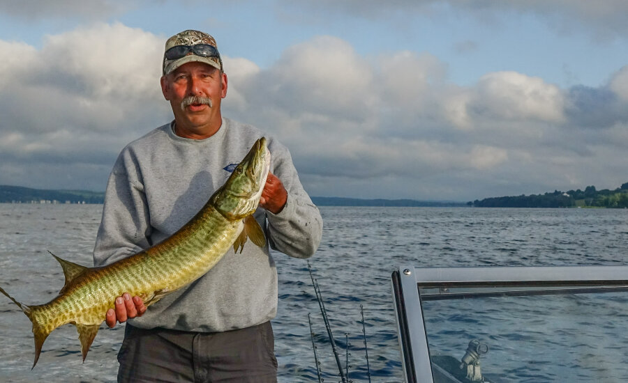 Mike Sperry Chautauqua Reel Outdoors on boat with Musky