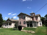 The Plum Bush House exterior with yard